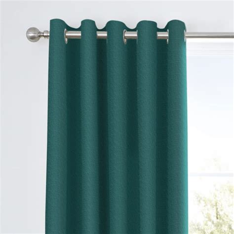 Tyla Teal Eyelet Blackout Curtains | Dunelm