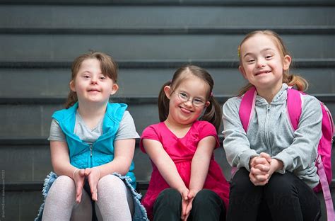 "Adorable Elementary Aged Children With Down Syndrome On School Steps ...