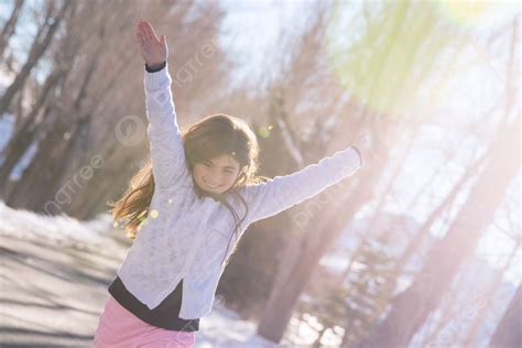 Beautiful Smiling Schoolgirl With Raised Up Hands Enjoying Warm Sunny ...