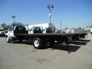 What is a Flatbed Truck? Dimensions, Weight, & Hauling Capacity – Road ...