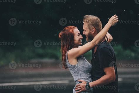 beautiful couple hugging in the rain 11740772 Stock Photo at Vecteezy