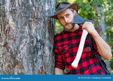 Lumberjack Worker Standing in the Forest with Axe. Lumberjack Holding ...