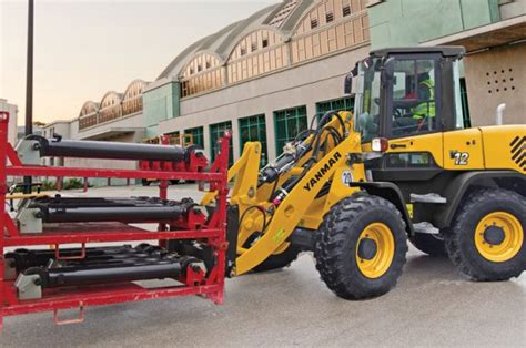 More Than Just a Loader: Specialty Buckets, Grapples, Forks and Snow ...