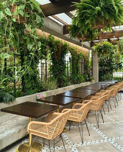 Garden vibe restaurant design filled with organized living plants ...