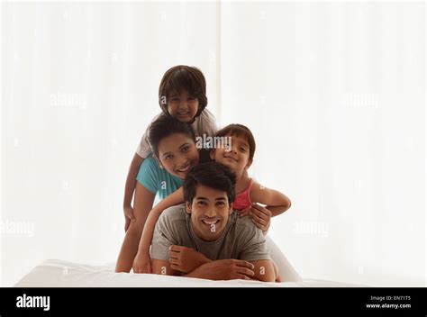 Portrait of family smiling Stock Photo - Alamy