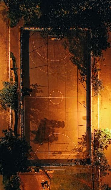 Premium Photo | Illuminated basketball court at night