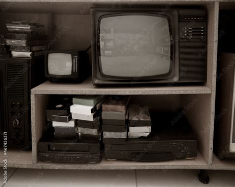 Old video recorder and tv . Vintage Video VHS Player on the shelf. VHS ...