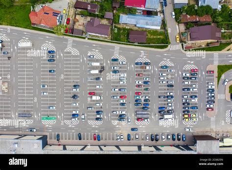 Parking lot and cars viewed from above, shopping mall parking area ...