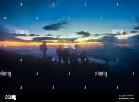 Climbers at sunrise on Acatenango Volcano, Antigua, Guatemala Stock ...