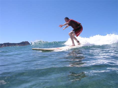 Surfing off of Waikiki Beach | Waikiki beach, Surfing, Waikiki