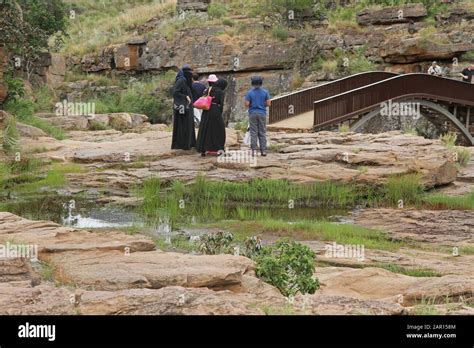 Muslim tourists at steel arching bridge Burke's Luck Potholes, Graskop ...