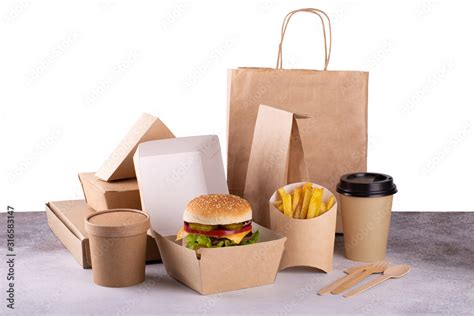 Delivery food eco packaging with burger and french fries, coffee ...