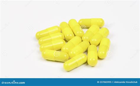 Yellow Capsules on White Background. Side View. Loop Motion. Rotation ...