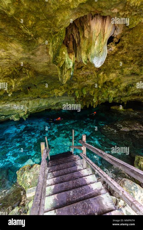 Cenote Dos Ojos in Quintana Roo, Mexico. People swimming and snorkeling ...