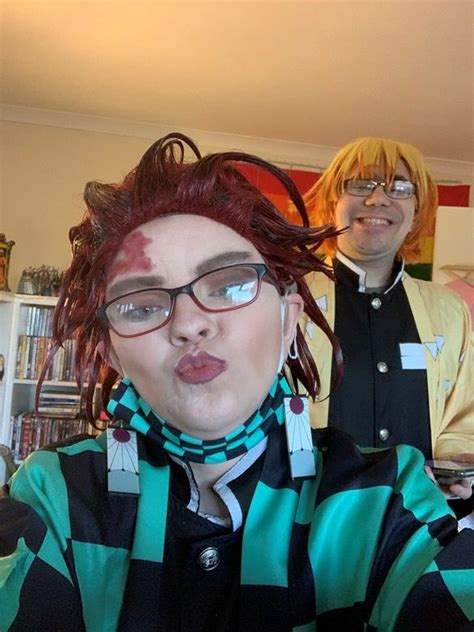 two people with red hair and glasses standing in front of a bookshelf ...