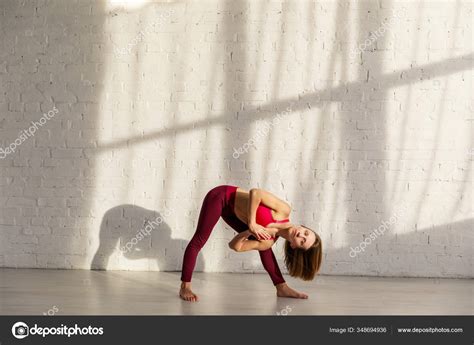 Sportive Woman Barefoot Doing Yoga Exercise Brick Wall Stock Photo by ...