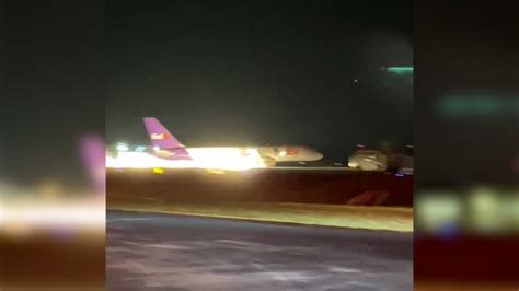 WATCH: FedEx plane skids off runway after crash-landing | WFLA