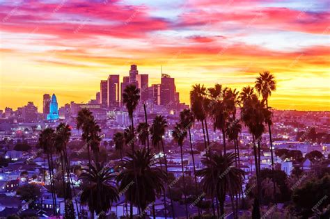 Premium Photo | View of downtown los angeles skyline with palm trees at ...