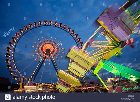 Illuminated fairground rides night Oktoberfest Munich Germany Stock ...