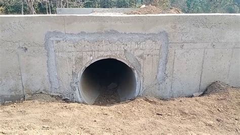 Encasing pipe Culvert, headwall,slab after construction side and front ...