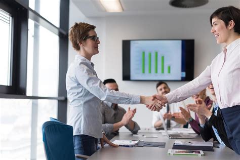 business womans handshake 12444058 Stock Photo at Vecteezy