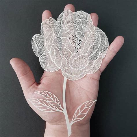 Artist Crafts Intricate Nature-Inspired Paper Cutting Art by Hand