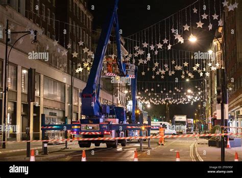 Christmas Lights London, England, UK Workman put up the Christmas ...