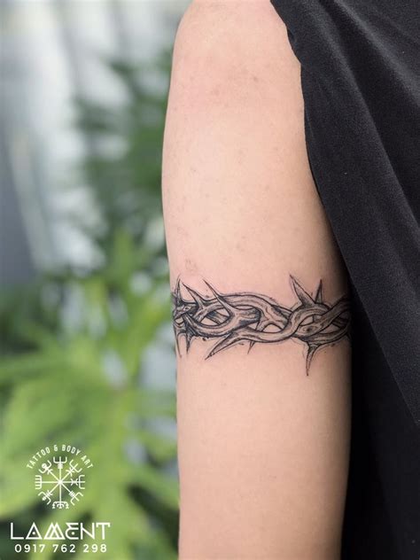 Crown Of Thorns Tattoo on arm | Tattoos, Thorn tattoo, Arm band tattoo