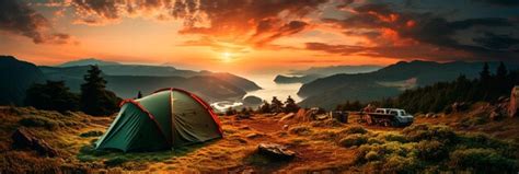 Premium AI Image | camping tent on mountain peak at sunrise travel and ...