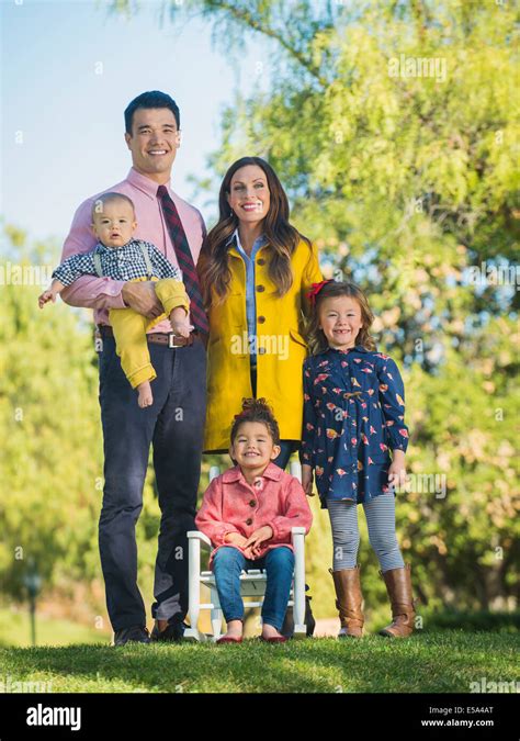 Family smiling together outdoors Stock Photo - Alamy