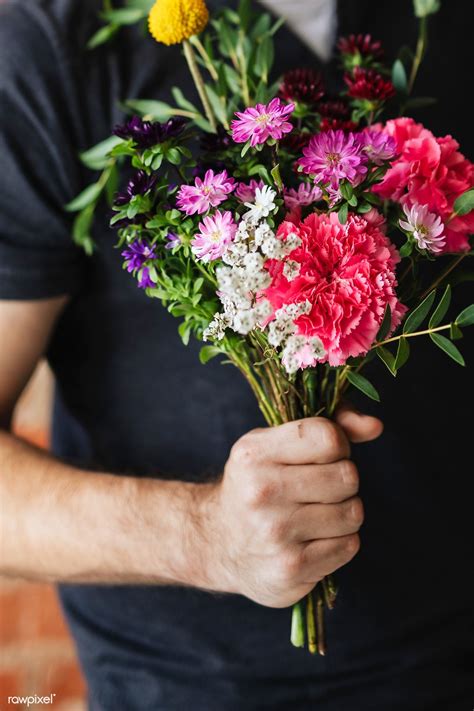 Man holding a bouquet of flowers | premium image by rawpixel.com ...