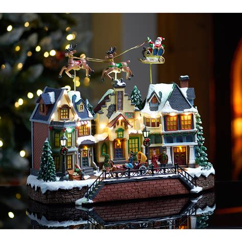 Musical Village Scene with Flying Sleigh