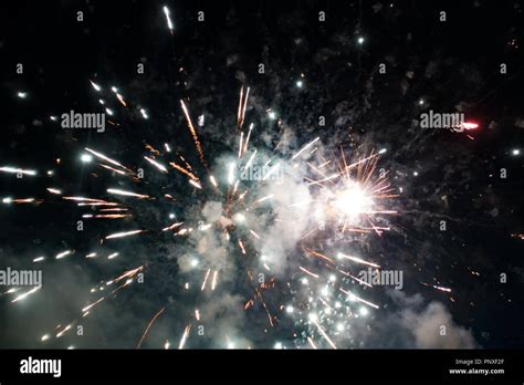 exploding fireworks in night sky Stock Photo - Alamy