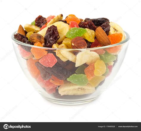 Dried fruits in glass bowl isolated Stock Photo by ©Martina_L 176490528