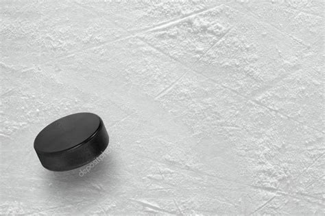 Hockey puck on ice — Stock Photo © karych #73872617