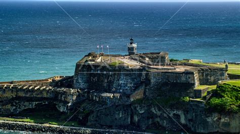 Historic fort along the coast resting on clear blue water, Old San Juan ...