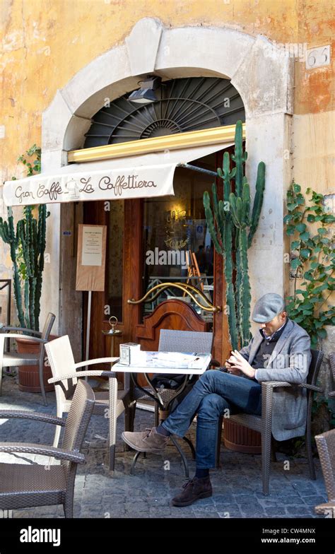 man sitting in cafe, Rome, Italy Stock Photo - Alamy