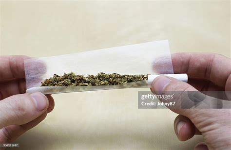 Rolling Marijuana Joint High-Res Stock Photo - Getty Images