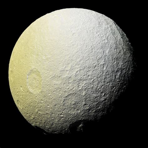 Mysterious Red Arcs Found on Saturn's Icy Moon Tethys