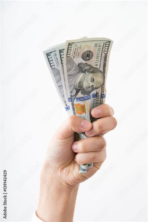 hand grabbing money Stock Photo | Adobe Stock