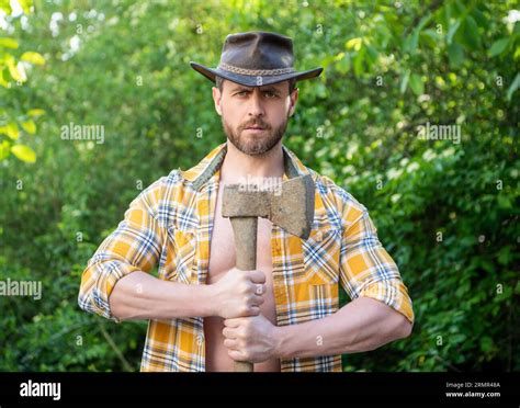 caucasian lumberjack with axe. lumberjack with axe wearing checkered ...