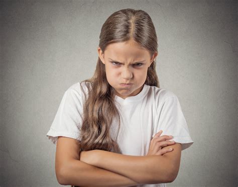 Headshot angry girl looking at you isolated on grey background - School Mum