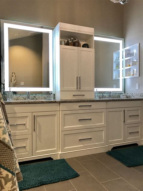 Custom white double vanity with center tower and Led Mirrors. We love ...