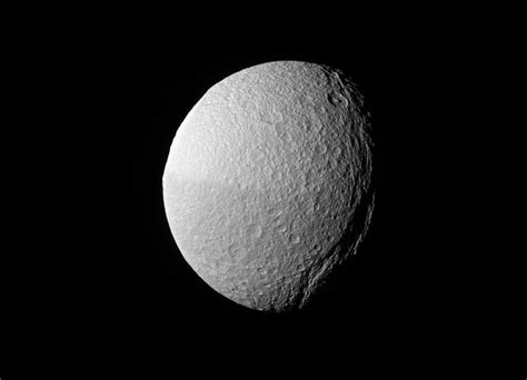 Saturn Moon Tethys' Giant Canyon Snakes into Darkness in Cassini Photo ...