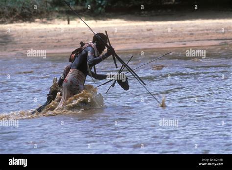 Native Spear Fishing in African River Stock Photo - Alamy