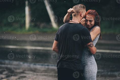 beautiful couple hugging in the rain 11743095 Stock Photo at Vecteezy