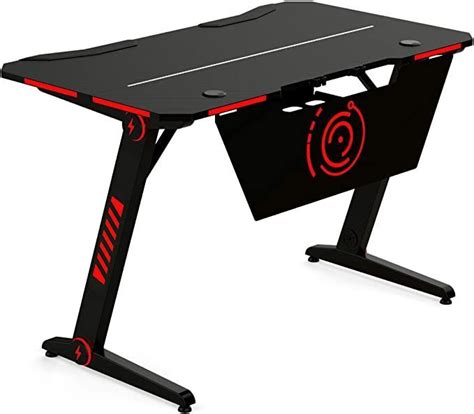 a black and red computer desk with an arrow symbol on it's side, in ...