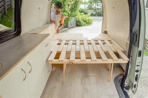 I love this custom slider bed design in a diy camper van conversion. It ...