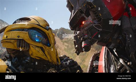 BUMBLEBEE, from left: Bumblebee (voice: Dylan O'Brien), Blitzwing ...