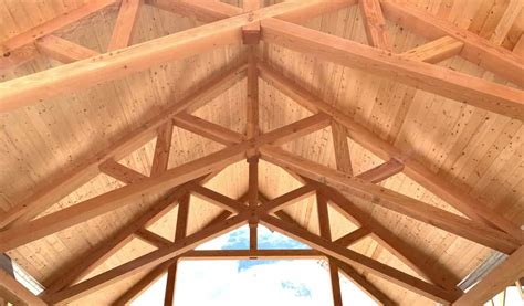 Timber frame trusses create an open and dramatic effect